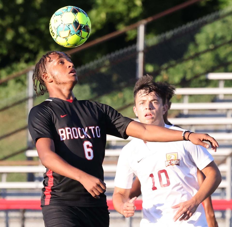 Brockton's Diogo DaGraca heads the soccer ball next to BC High defender Matt Studley during a game on Thursday, Sept. 8, 2022. 