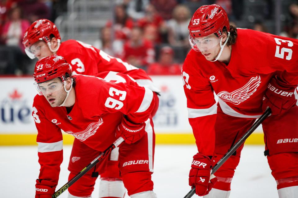Detroit Red Wings right wing Alex DeBrincat (93), Detroit Red Wings defenseman Moritz Seider (53) and left wing Lucas Raymond (23) look on before a face-off against Montreal Canadiens during the second period at Little Caesars Arena in Detroit on Monday, April 15, 2024.