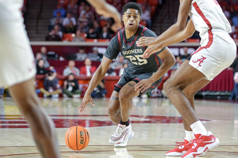 Oklahoma guard Grant Sherfield (25) looks to pass in the first half during a basketball game between The Oklahoma Sooners (OU) and The Alabama Crimson Tide at the Lloyd Noble Center in Norman, Okla., Saturday, Jan. 28, 2023.