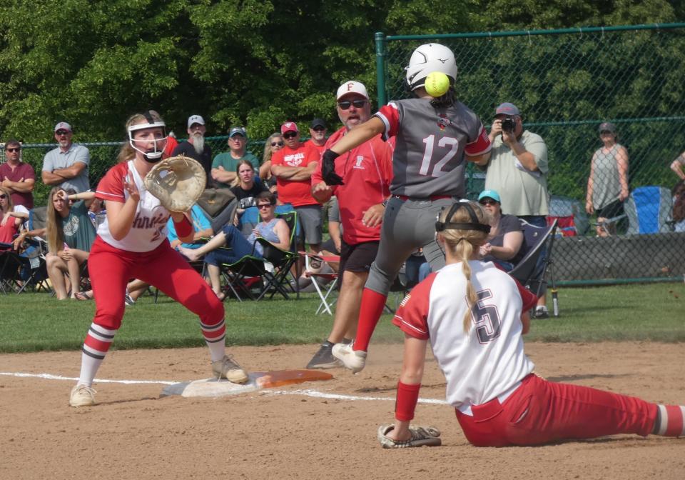 Johnstown junior pitcher Macy Walters throws to sophomore first baseman Emily Yanczura in an attempt to retire Fredericktown sophomore Trinity Garretson during a Division III district final at Pickerington Central on Saturday, May 20, 2022. The Johnnies fell 5-2 to the Freddies.