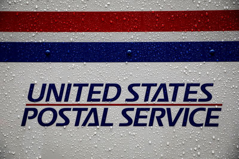 FILE PHOTO: A United States Postal Service (USPS) truck is seen in the rain in Manhattan