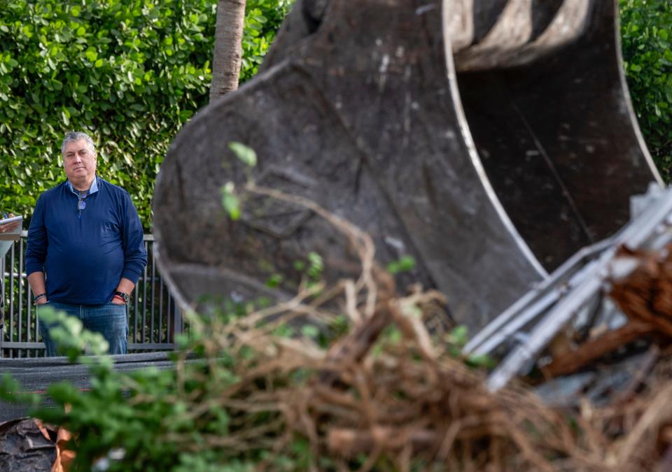 Tom Cush watches the home he purchased being demolished at 238 Monceaux Road in West Palm Beach, Florida on February 1, 2022. He plans to build a new home on the property.