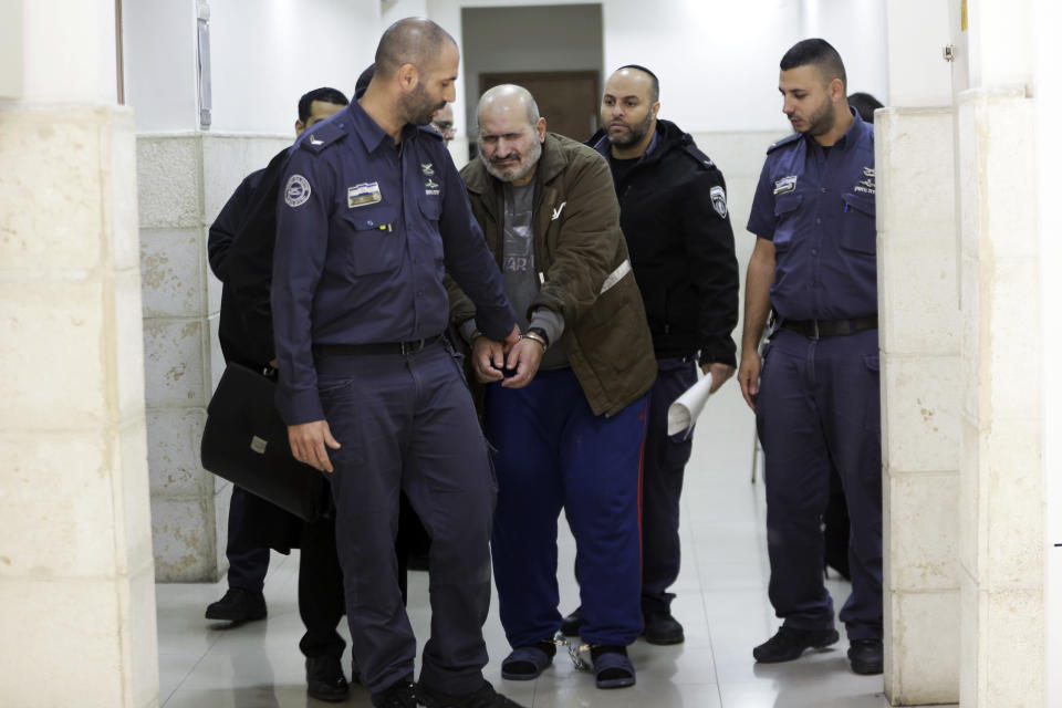 Israeli police escorts a 60-year-old Palestinian Jamil Tamimi into a court in Jerusalem, Thursday, Jan. 10, 2019. Tamimi was sentenced to 18 years for killing British exchange student Hannah Bladon on the Jerusalem light rail in April 2017. Tamimi's defense team claimed he suffered from a mental illness, and the attack was not ideologically or politically motivation.(AP Photo/Mahmoud Illean)