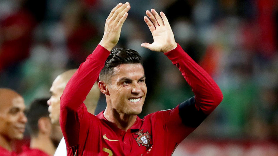 Pictured here, Cristiano Ronaldo salutes the crowd after breaking the goal scoring record.