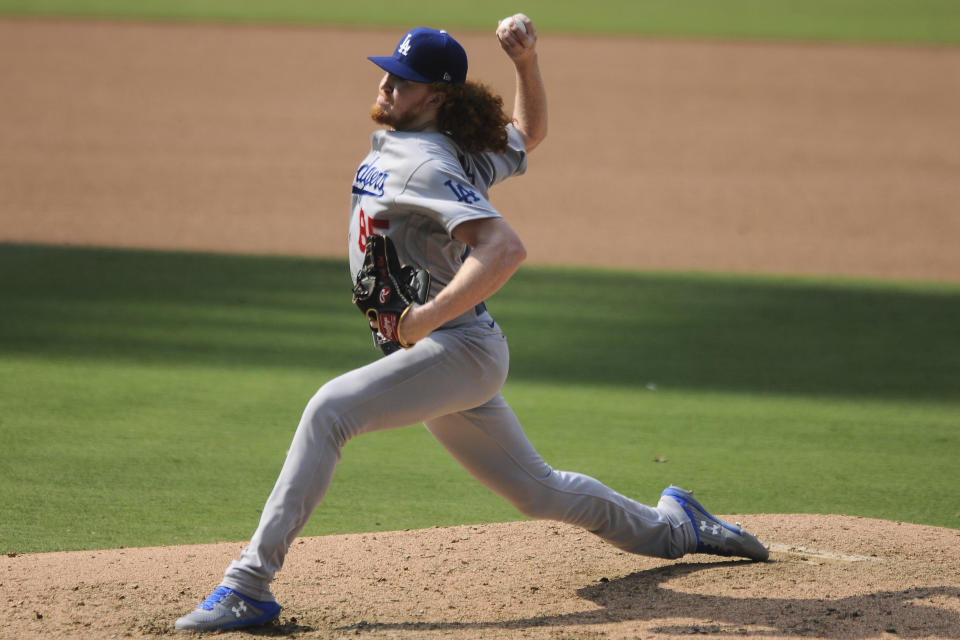 Los Angeles Dodgers' relief pitcher Dustin May delivers a pitch against the San Diego Padres in the fifth inning of a baseball game Wednesday, Sept. 16, 2020, in San Diego. (AP Photo/Derrick Tuskan)