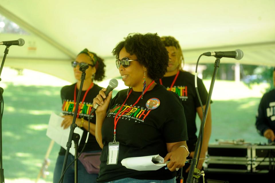 Adrienne King of the Juneteenth planning committee speaks at the opening of Sunday's Juneteenth celebration at the Mercer Museum in Doylestown Pa.