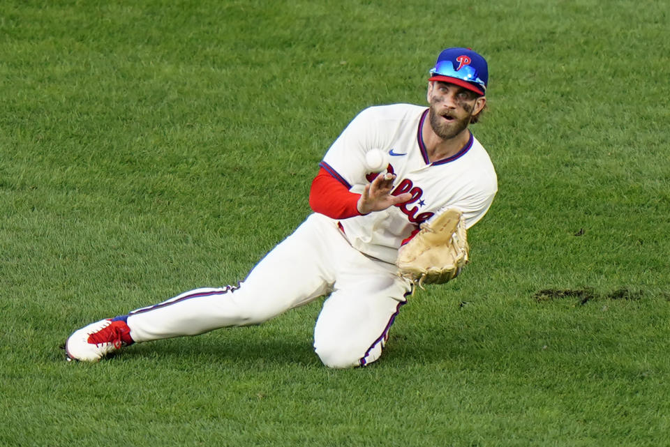 Philadelphia Phillies right fielder Bryce Harper catches a line out by Toronto Blue Jays' Alejandro Kirk during the sixth inning of the first baseball game in a doubleheader, Friday, Sept. 18, 2020, in Philadelphia. (AP Photo/Matt Slocum)