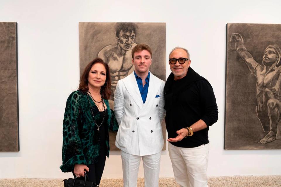 Gloria Estefan, Rocco Ritchie and Emilio Estefan at Ritchie’s Design District art show in Miami’s Design District Wednesday night.