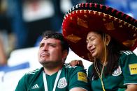 <p>Two Mexico fans react to their team’s defeat after the Russia 2018 World Cup round of 16 football match between Brazil and Mexico at the Samara Arena in Samara on July 2, 2018. (Photo by BENJAMIN CREMEL / AFP) </p>