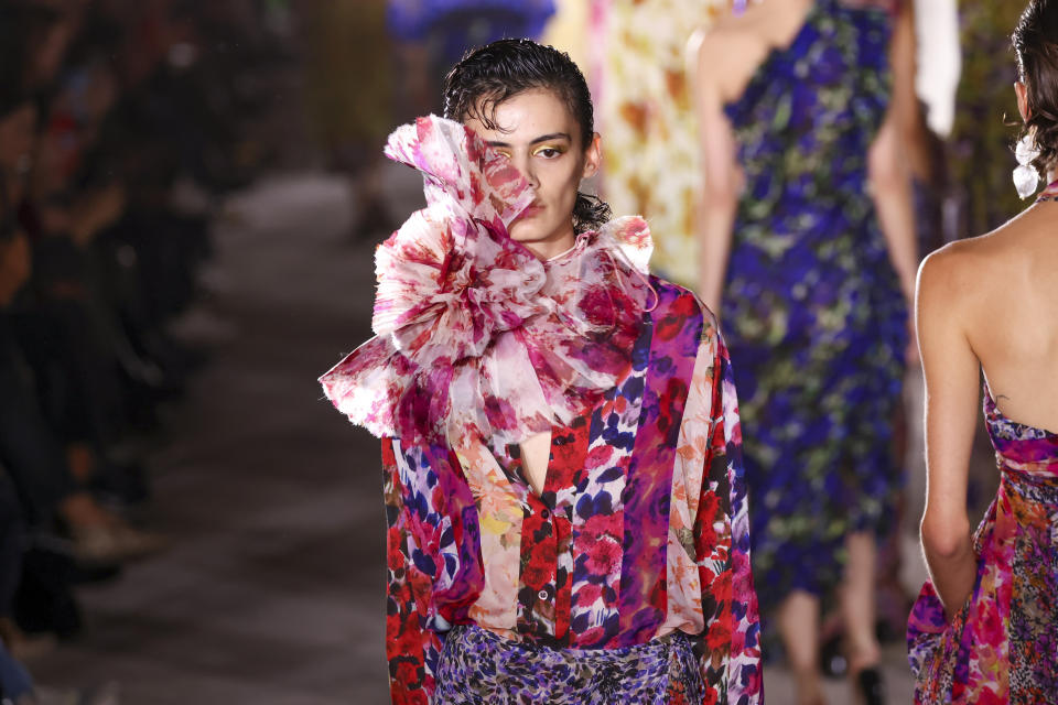 A model wears a creation for the Dries Van Noten ready-to-wear Spring/Summer 2023 fashion collection presented Wednesday, Sept. 28, 2022 in Paris. (Photo by Vianney Le Caer/Invision/AP)