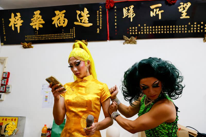 FILE PHOTO: Nymphia Wind and another Taiwanese drag queen prepare before their performance at a local temple in Taipei