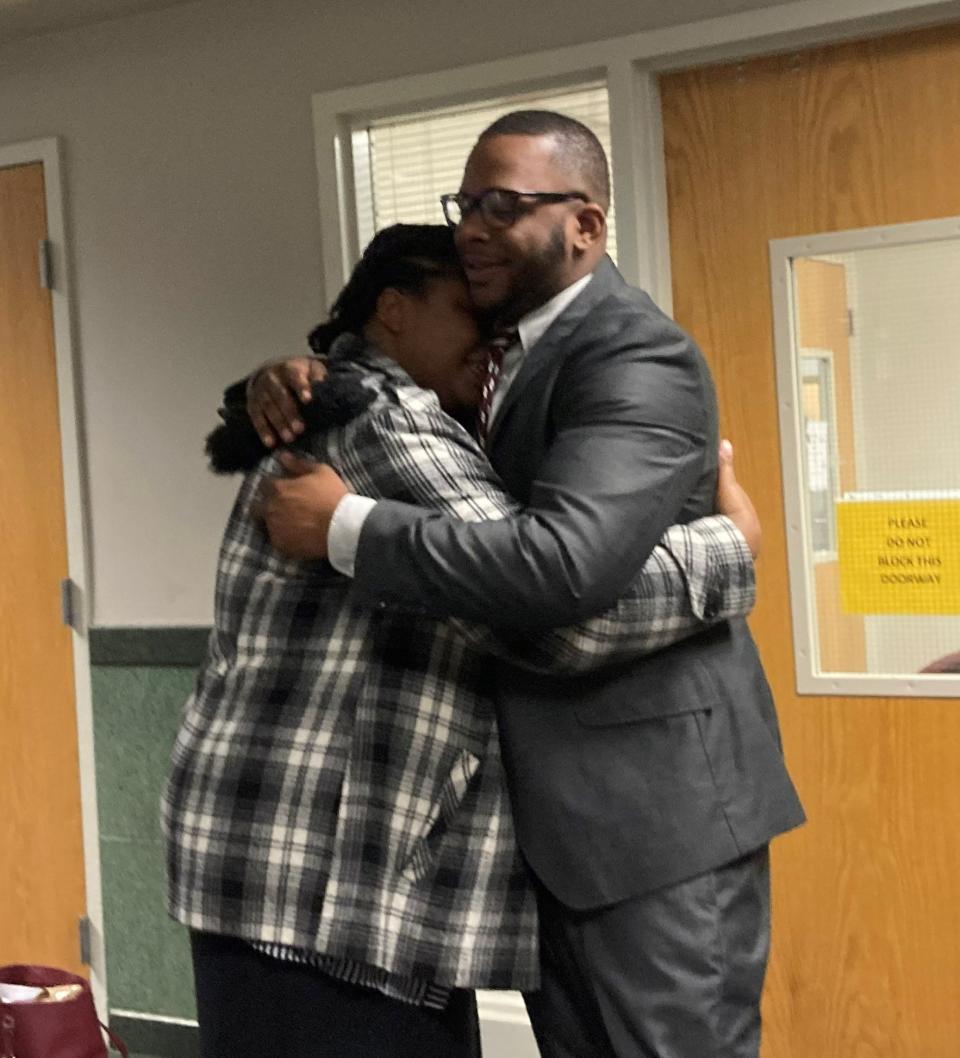 Andre Isaac hugs his sister, Lacole Isaac, after his acquittal on Wednesday.