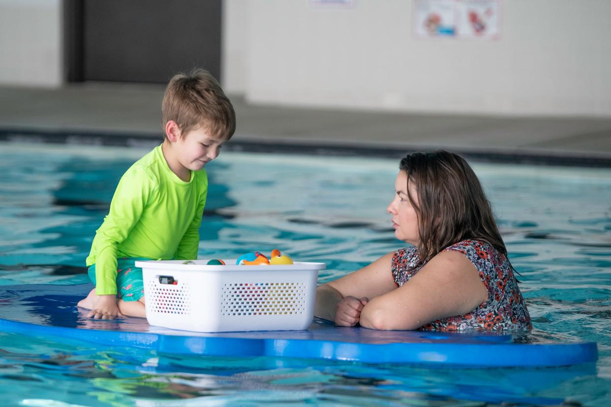 Remington Harmes, 4, plays atop a floatie as his mom, Elizabeth Harmes, watches during a new swim sensory program for people with disabilities at the Pueblo Regional Center swimming pool on Friday, Jan. 13, 2023.