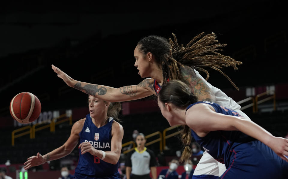 Serbia's Nevena Jovanovic (8), left, and Angela Dugalic (32), right, scramble for a rebound with United States' Brittney Griner (15), center, and during women's basketball semifinal game at the 2020 Summer Olympics, Friday, Aug. 6, 2021, in Saitama, Japan. (AP Photo/Eric Gay)