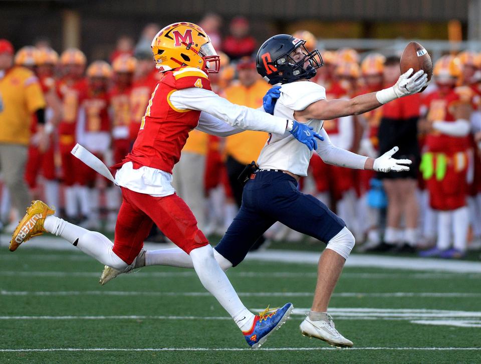Rochester's Henry Buecker reaches for a pass during the game against Murphysboro Saturday, Nov. 18, 2023.