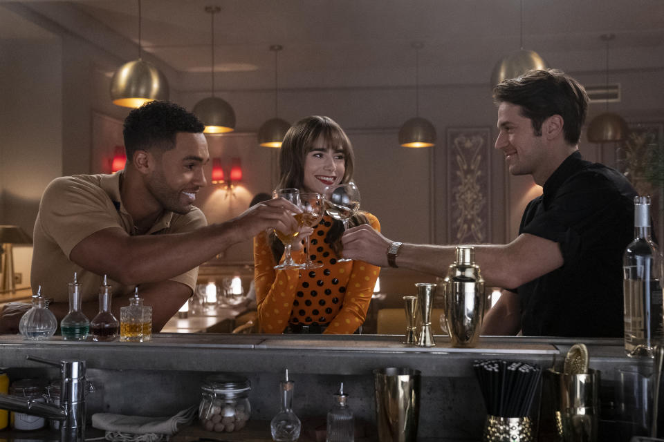 (L to R) Lucien Laviscount as Alfie, Lily Collins as Emily, Lucas Bravo as Gabriel in episode 305 of Emily in Paris. (Stéphanie Branchu/Netflix)