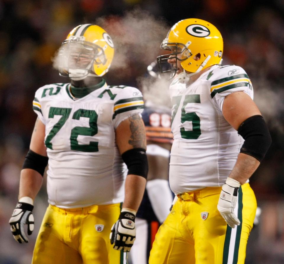 With the temperatures hovering around zero, steam rises from the faces of Green Bay Packers' Jason Spitz, left, and Tony Moll, during the first quarter against the Chicago Bears on Monday, Dec. 22, 2008, at Soldier Field.