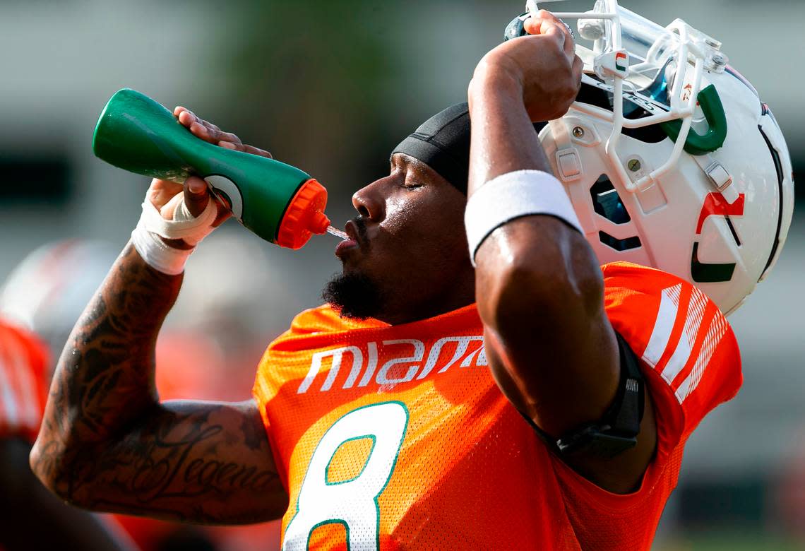 Miami Hurricanes wide receiver Frank Ladson, Jr., (8) drinks water during practice drills at the University of Miami’s Greentree Practice Fields on Monday, Aug. 8, 2022, in Coral Gables, Fla.