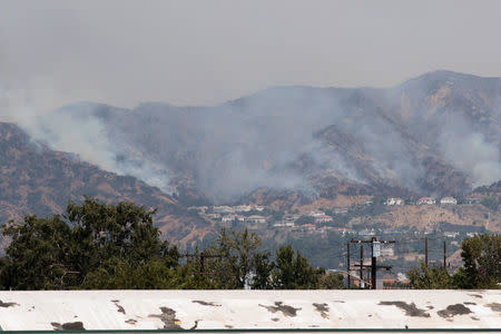 The La Tuna Canyon fire over Burbank, California, September 2, 2017. REUTERS/Kyle Grillot