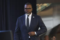 Chicago Mayor Brandon Johnson returns to his seat after speaking at the unveiling in Chicago on Wednesday, April 24, 2024. The Chicago Bears unveiled a nearly $5 billion proposal Wednesday for an enclosed stadium next door to their current home at Soldier Field as part of a major project that would transform the city's lakefront, and they are asking for public funding to help make it happen. The plan calls for $3.2 billion for the new stadium plus an additional $1.5 billion in infrastructure. (AP Photo/Teresa Crawford)