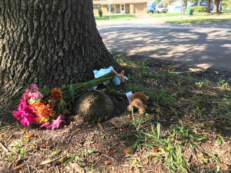 A bouquet of chrysanthemums and two small stuffed animals placed near where two teenagers were shot by a Brevard County Sheriff's Office deputy on Ivy Street in Cocoa. No details were immediately released on the circumstances of the shooting.