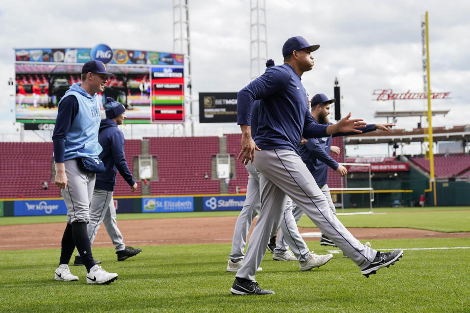 Tampa Bay Rays players stretch before a baseball game against the Cincinnati Reds, Monday, April 17, 2023, in Cincinnati. (AP Photo/Joshua A. Bickel)