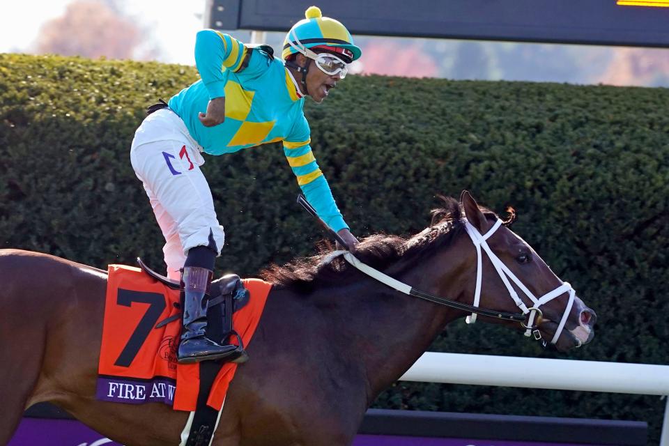 Jockey Ricardo Santana Jr. celebrates after riding Fire At Will to win the Breeders' Cup Juvenile Turf horse race at Keeneland Race Course, Friday, Nov. 6, 2020, in Lexington, Kentucky.