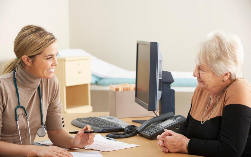 Senior woman visiting Doctor in doctor's office
