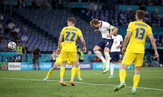 Harry Kane, centre, heads England's third goa