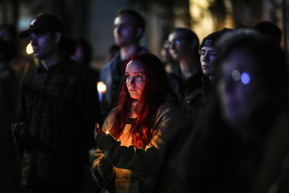 People gather at a vigil for the victims of Wednesday's mass shootings, Sunday, Oct. 29, 2023, outside the Basilica of Saints Peter and Paul in Lewiston, Maine. (AP Photo/Matt Rourke)