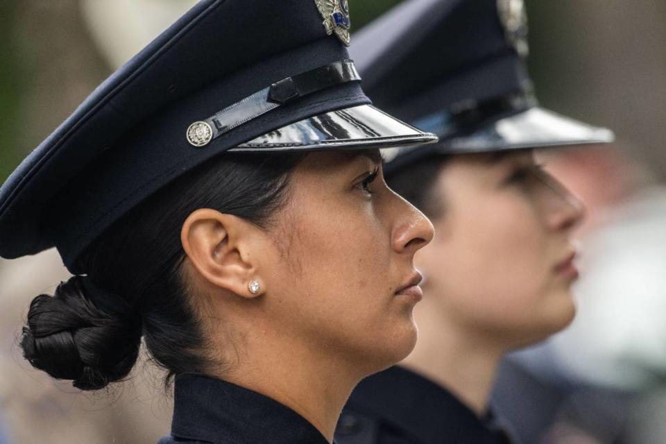 San Bernardino police officers Vanessa Ruiz and Priscilla Perez stand at attention Monday during the California Peace Officers’ Memorial Ceremony at the state Capitol.