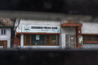 Kashmir Press Club building is pictured through a closed gate after it was sealed by authorities in Srinagar, Indian controlled Kashmir, Tuesday, Jan. 18, 2022. Under Modi, press freedoms in India have steadily shrunk after he was first elected in 2014. Last year, India was ranked 142nd in the global press freedom index by media watchdog Reporters Without Borders, below Afghanistan and Zimbabwe. Authorities try to control any narrative seen opposite to the official line that Kashmir is an integral part of India. (AP Photo/Dar Yasin)