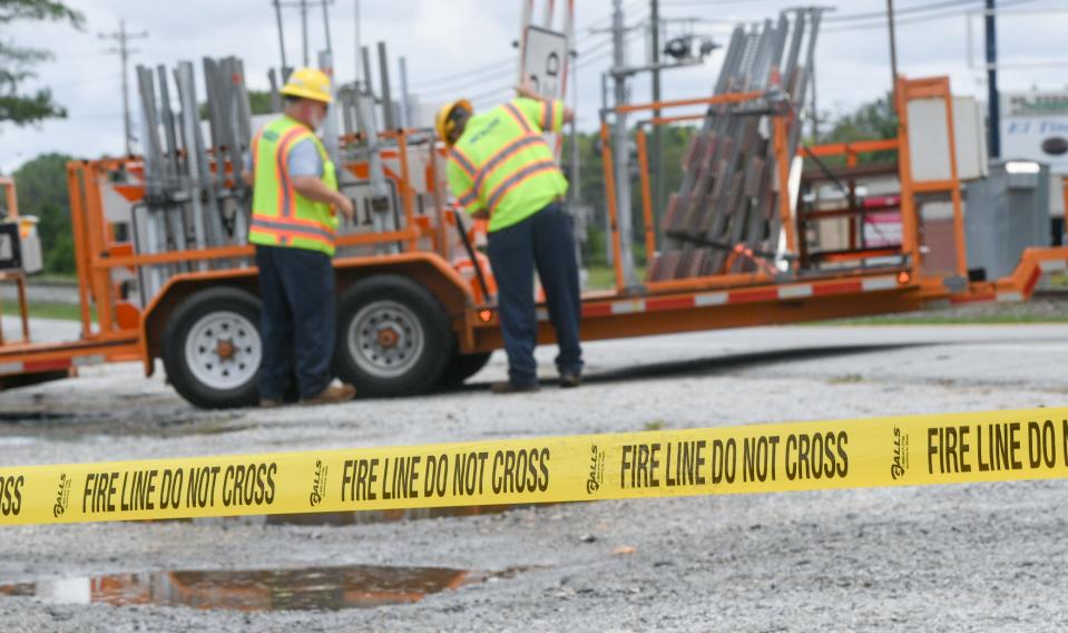 SCDOT workers place road closed signs on State Highway 20 at Blake Dairy Road in Belton, S.C. Thursday, July 25, 2024.