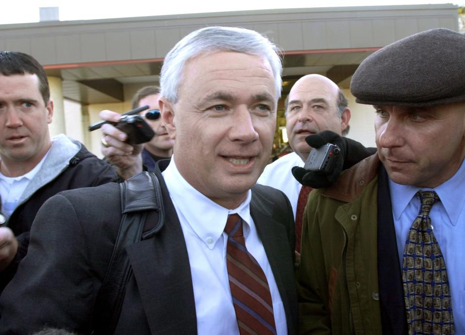 Former Alabama football coach Dennis Franchione answers a question about Alabama fans' disappointment as he arrives in College Station, Texas on Thursday, Dec. 5, 2002. Franchione left Alabama to become the head coach at Texas A&M.