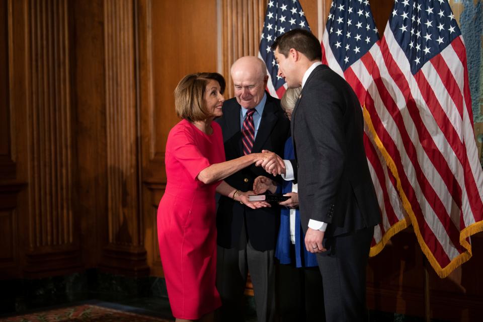 Rep. Seth Moulton (D, MA) greets House Speaker Nancy Pelosi (D, CA) before being ceremonially sworn in to Congress on January 3, 2019 in Washington D.C.