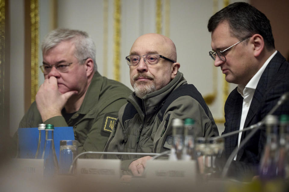 Ukraine's Defense Minister Oleksiy Reznikov, center, and Ukraine's Foreign Minister Dmytro Kuleba, right, attend a working session at the EU-Ukraine summit in Kyiv, Ukraine, Friday, Feb. 3, 2023. (Ukrainian Presidential Press Office via AP)