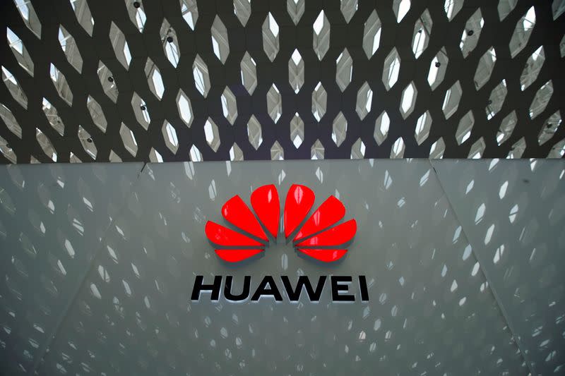 FILE PHOTO: A Huawei company logo is seen at the Shenzhen International Airport in Shenzhen