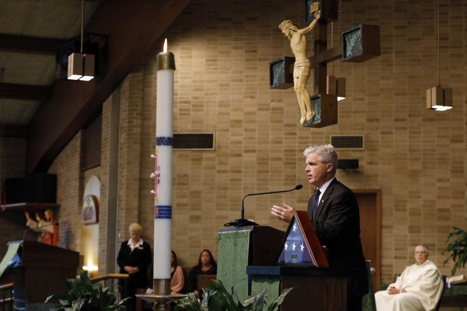 Suffolk County Executive Steve Bellone speaks during the funeral for Evelyn Rodriguez, at Saint Anne's Roman Catholic Church, in Brentwood, N.Y., Friday, Sept. 21, 2018. Rodriguez, 50, is a mother recognized by President Donald Trump for turning grief over her daughter's suspected gang killing into a crusade against MS-13. She was struck and killed by an SUV on Sept. 14 after a heated confrontation with the driver over the placement of a memorial to her slain daughter, Kayla Cuevas. (AP Photo/Richard Drew)