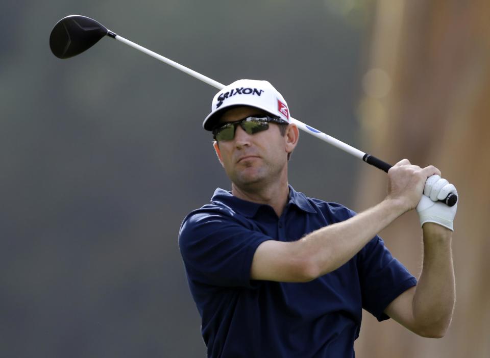 George McNeill drives on the ninth tee in the third round of the Northern Trust Open golf tournament at Riviera Country Club in the Pacific Palisades area of Los Angeles Saturday, Feb. 15, 2014. (AP Photo/Reed Saxon)