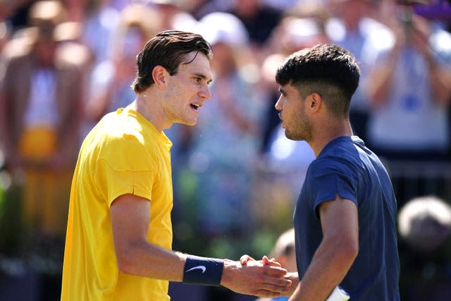 Jack Draper (left) shakes hands with Carlos Alcaraz