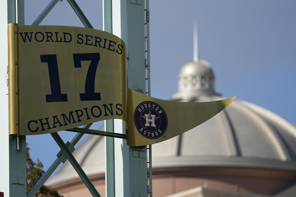The Houston Astros World Series banner is seen Monday, Oct. 25, 2021, in Houston. The Astros face the Atlanta Braves in Game 1 of baseball's World Series tomorrow. (AP Photo/David J. Phillip)
