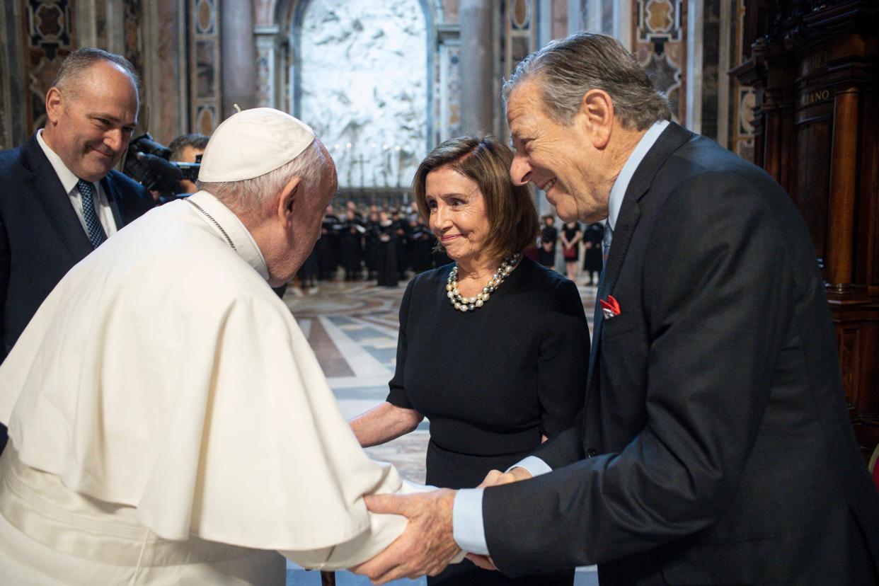 Pope Francis, greets Speaker of the House Nancy Pelosi, D-Calif., and her husband, Paul Pelosi before celebrating a Mass on the Solemnity of Saints Peter and Paul, in St. Peter's Basilica at the Vatican, Wednesday, June 29, 2022.