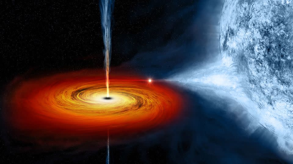 In an artist's illustration, a black hole pulls material from a companion star, forming a disc that rotates around the black hole before falling into it. - NASA/CXC/M. Weiss