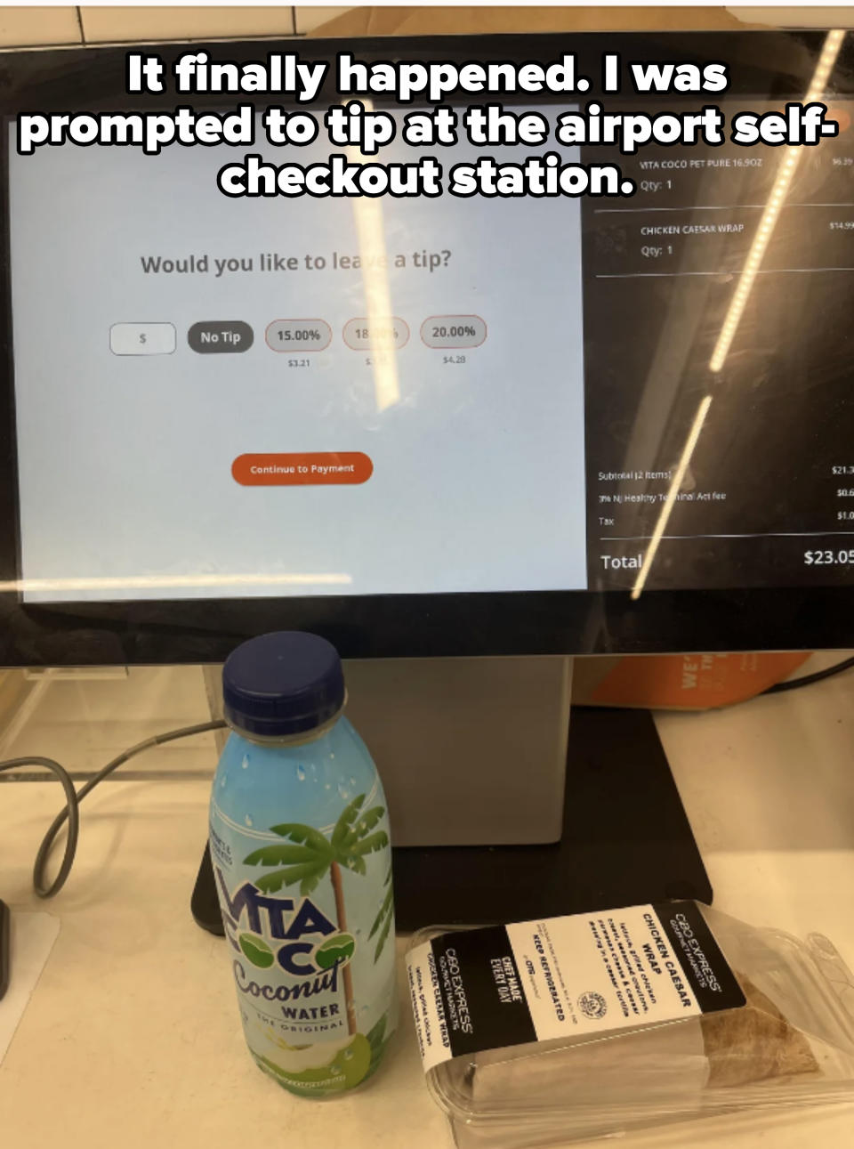 A checkout screen prompting for a tip selection, with a bottle of Vita Coco coconut water and a package of Costco chicken Caesar wrap on the counter