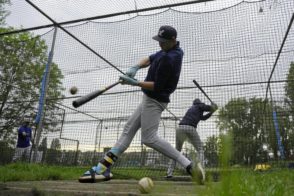 Members of the UK baseball team London Mets practice during a training session at the Finsbury Park in London, Thursday, May 16, 2024. Baseball at the highest club level in Britain is competitive. Teams are mélange of locals and expats some with college and minor league experience. (AP Photo/Kin Cheung)