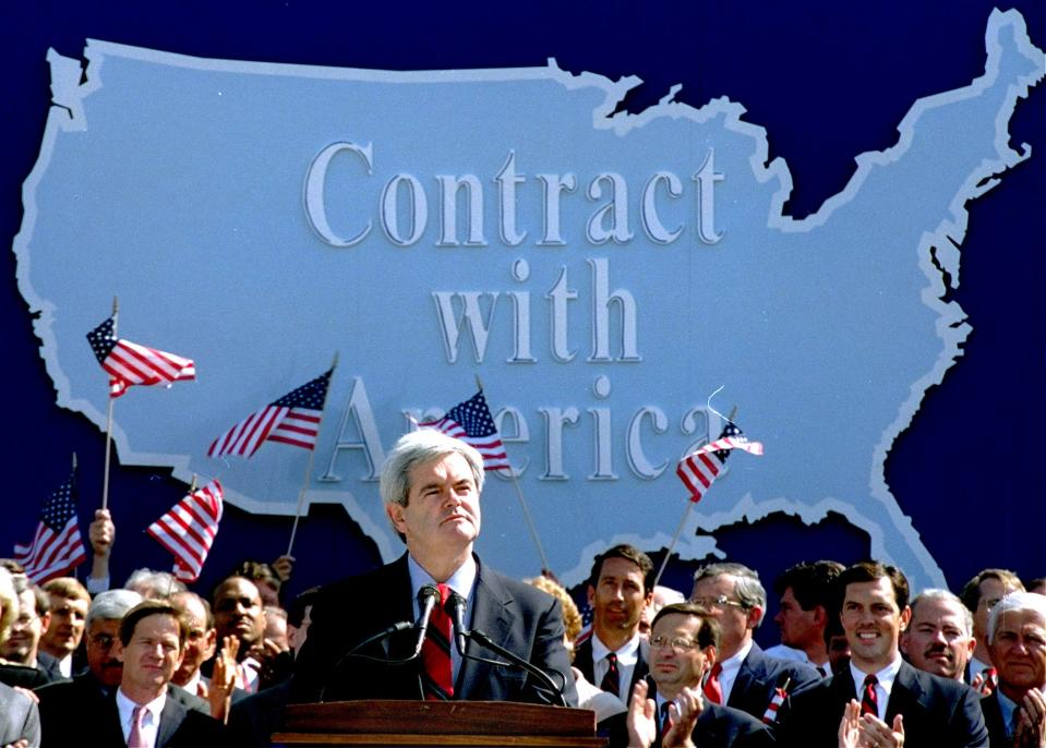 Newt Gingrich addresses Republican congressional candidates on Capitol Hill on Sept. 27, 1994, during a rally where they pledged a "Contract with America."