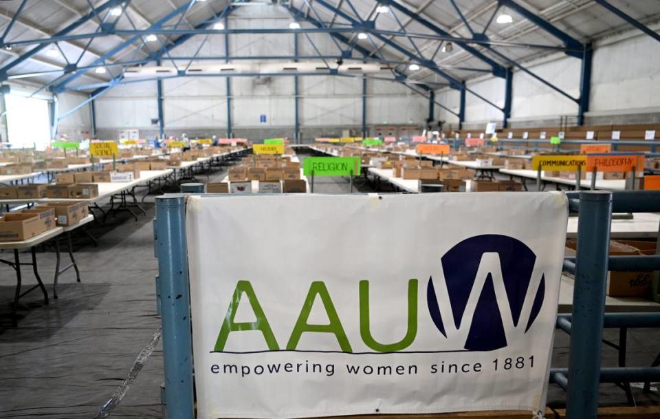 Volunteers start to set up Thursday for the AAUW Used Book Sale at the Penn State Snider Agriculture Arena.