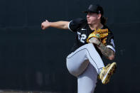 Chicago White Sox pitcher Mike Clevinger throws during an MLB spring training baseball practice, Saturday, Feb. 18, 2023, in Phoenix. (AP Photo/Matt York)