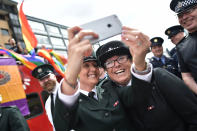 <p>PSNI and Garda officers representative of the gay community take a selfie before taking part in the Belfast Gay Pride parade on Aug. 5, 2017 in Belfast, Northern Ireland. (Photo: Charles McQuillan/Getty Images) </p>