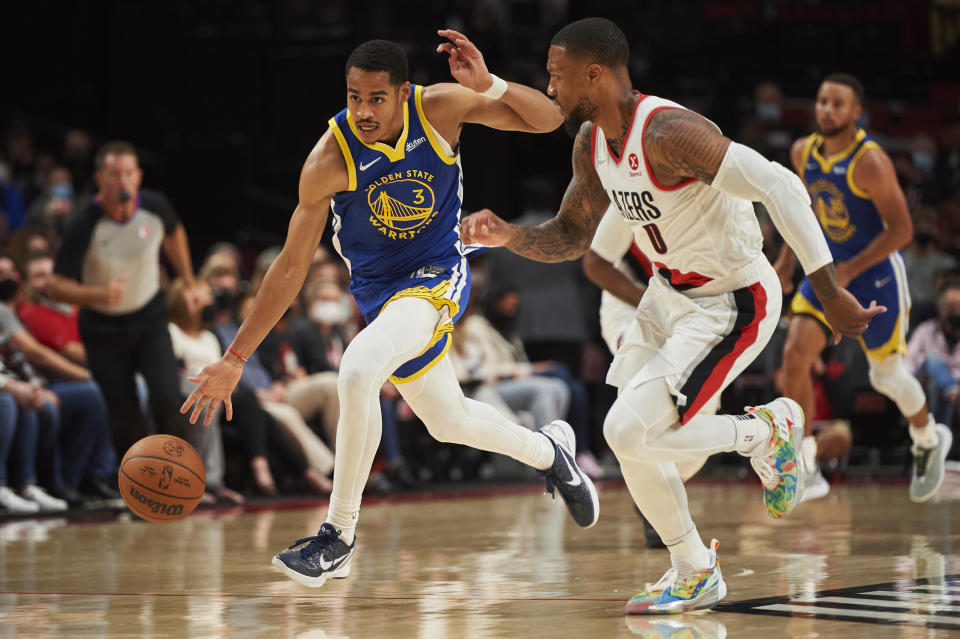 Oct 4, 2021; Portland, Oregon, USA; Golden State Warriors guard Jordan Poole (3) drives to the basket during the first half against Portland Trail Blazers guard <a class="link " href="https://sports.yahoo.com/nba/players/5012" data-i13n="sec:content-canvas;subsec:anchor_text;elm:context_link" data-ylk="slk:Damian Lillard;sec:content-canvas;subsec:anchor_text;elm:context_link;itc:0">Damian Lillard</a> (0) at Moda Center. Mandatory Credit: Troy Wayrynen-USA TODAY Sports
